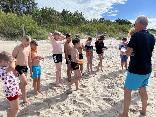 Obóz STE Międzywodzie 2022 - Pasowanie dzieci na "Wilka Morskiego" - 25